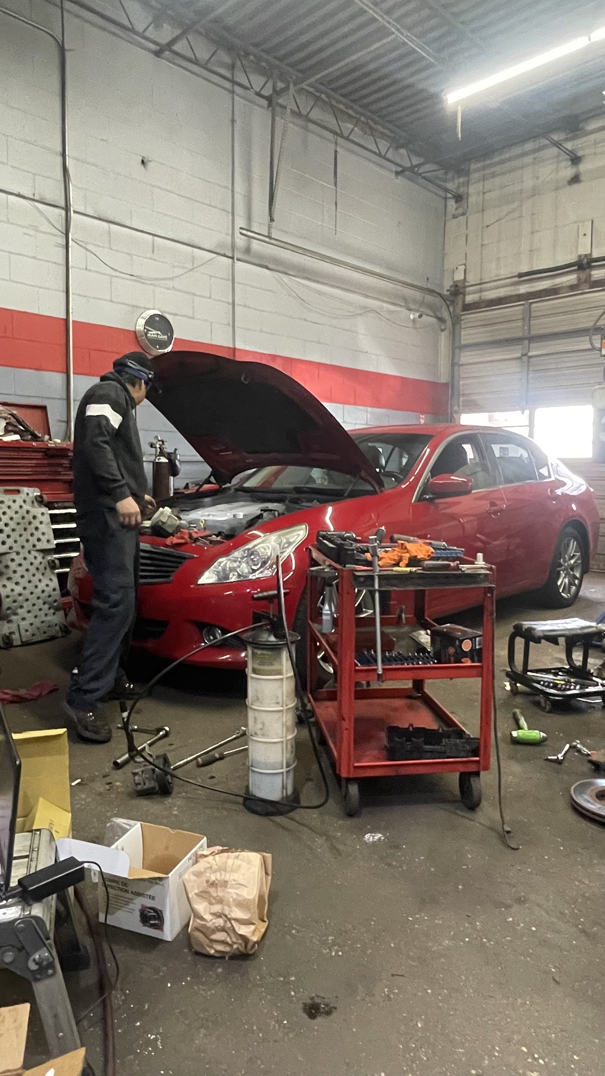Vehicle being serviced inside Cabrera Auto Repair